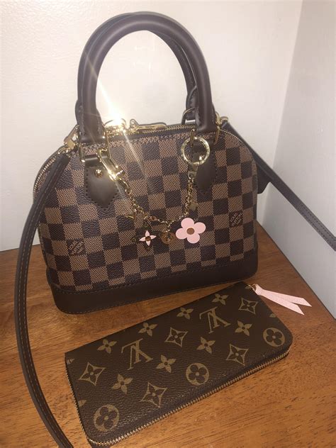 louis vuitton wallet flower charm